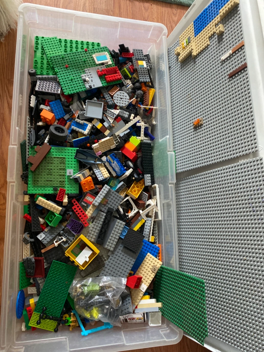 Large Tub of assorted LEGO bricks and baseplates