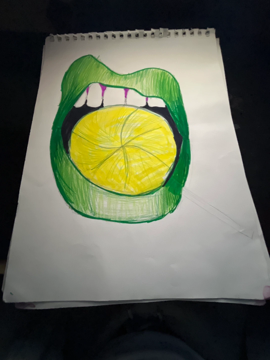 Hand-drawn artwork of open mouth with lemon