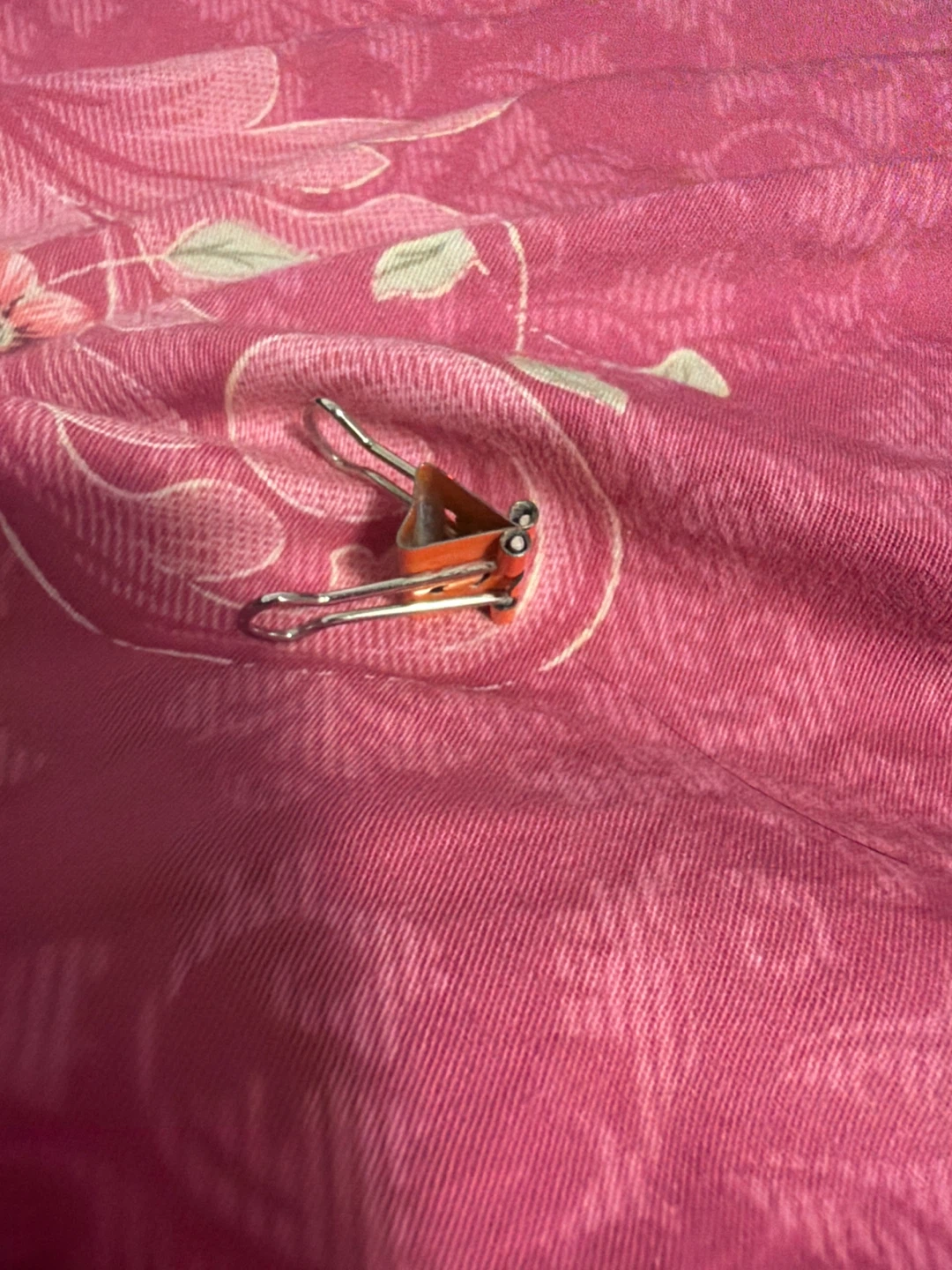 Orange binder clip