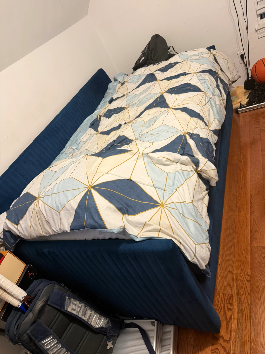 Blue upholstered sofa bed