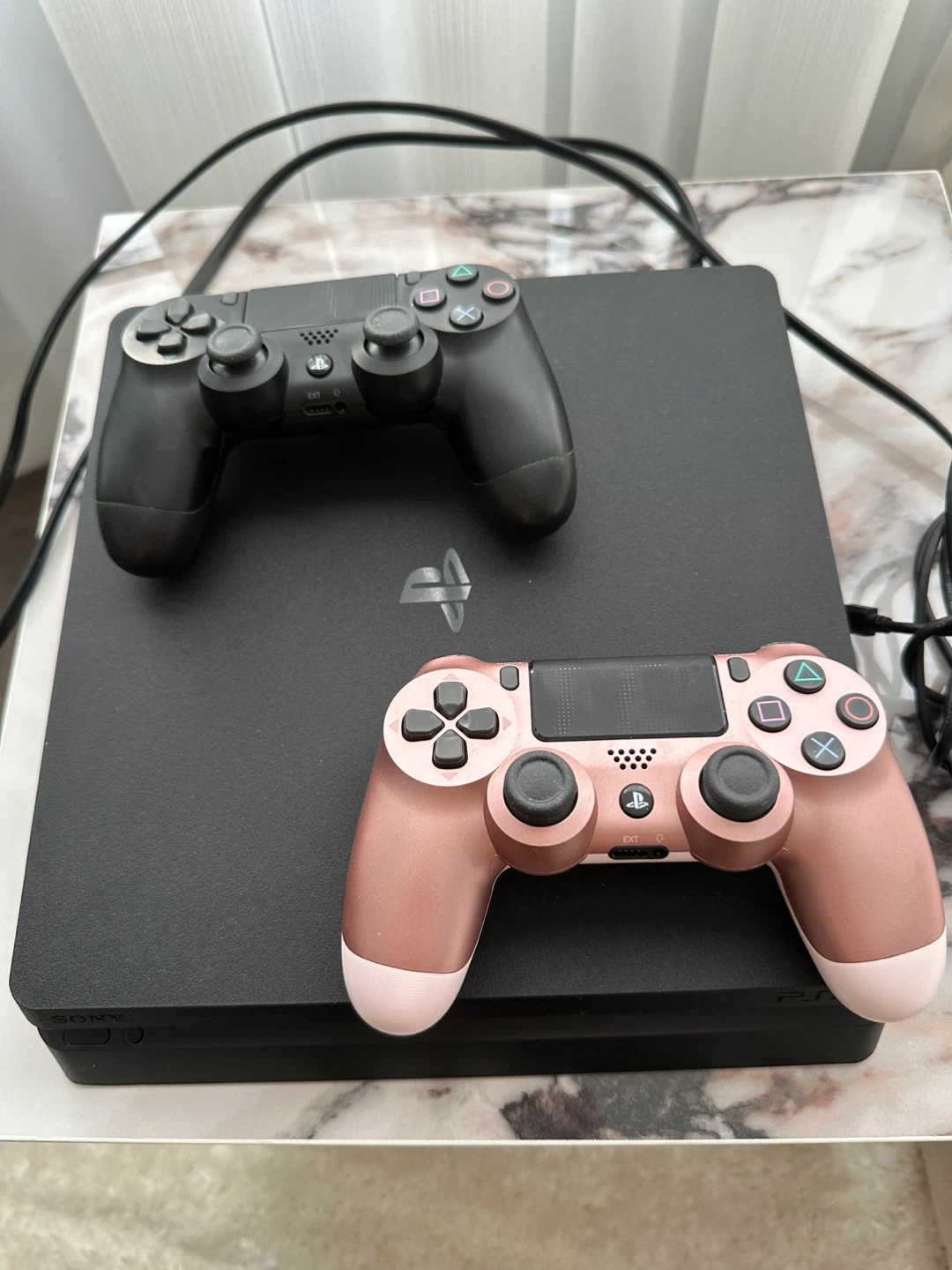 PlayStation 4 Slim Console with Two Controllers