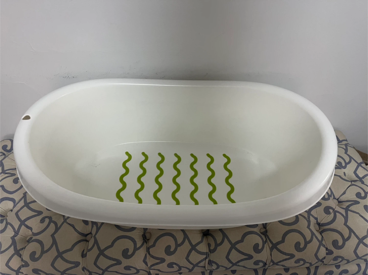 White Baby Bathtub with Green Wavy Grips