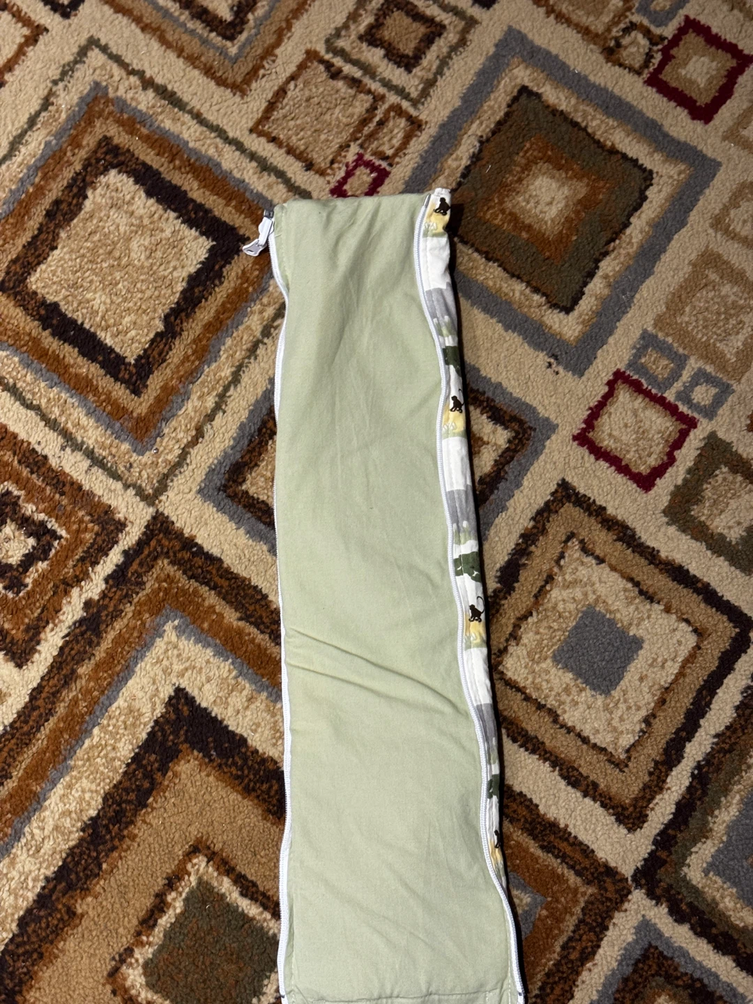 Crib post covers with reversible Safari Animal Print.
