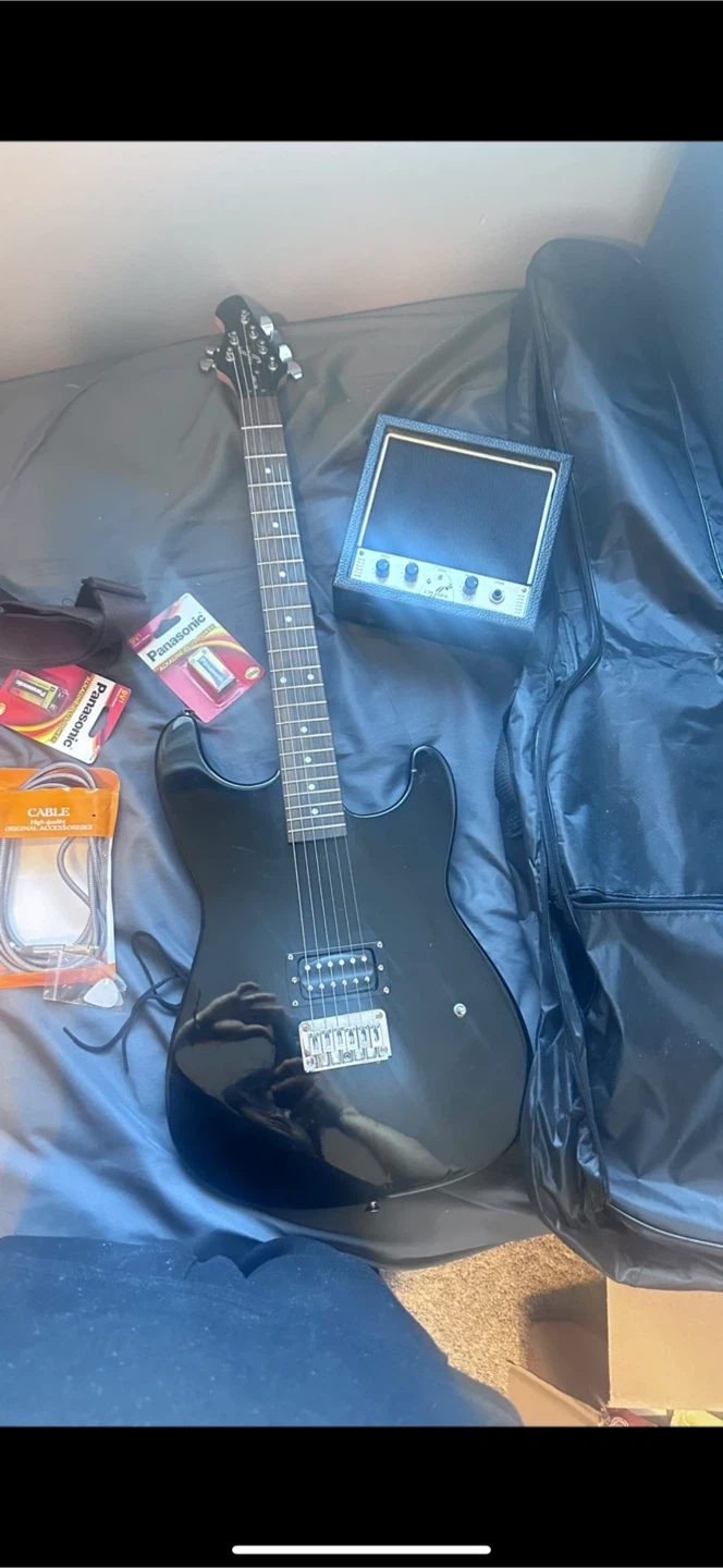 First Act Electric Guitar with Amp, Cable, and Batteries
