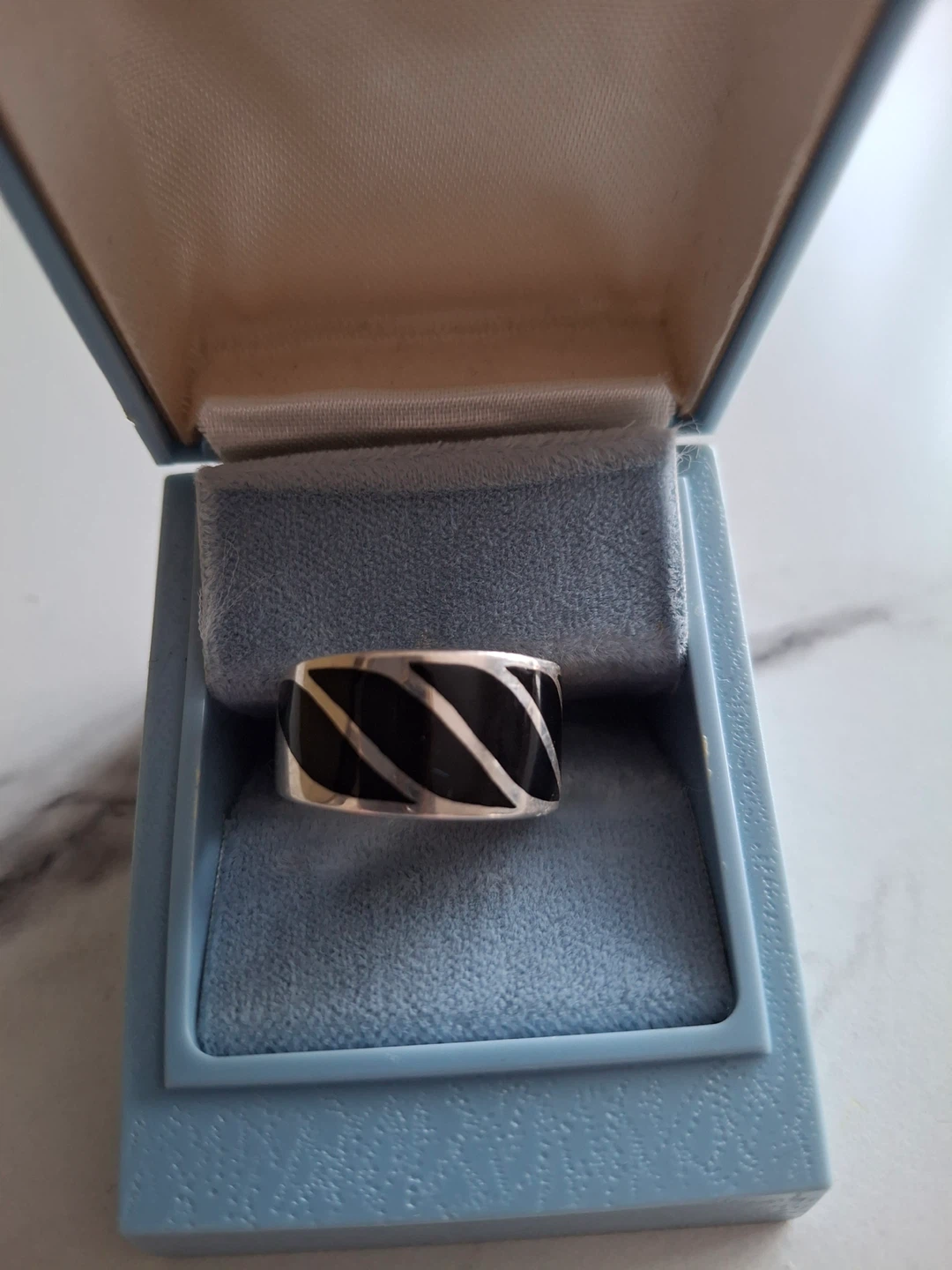 Silver ring (stamped 925) with black detail