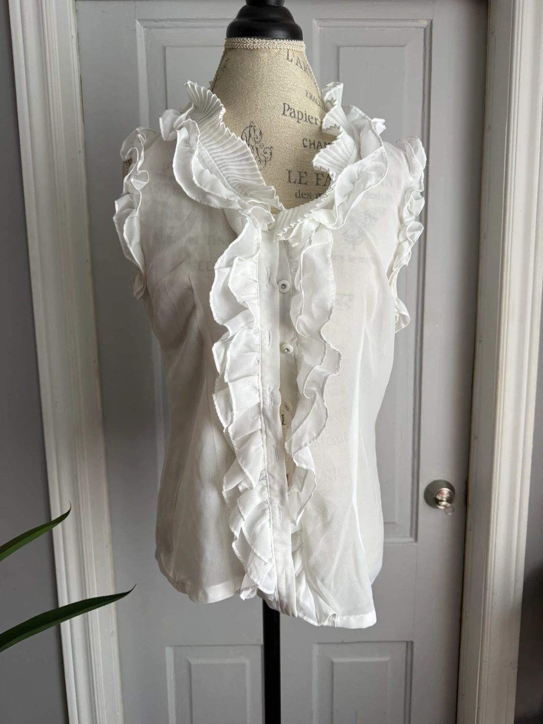 White Ruffled Sleeveless Blouse