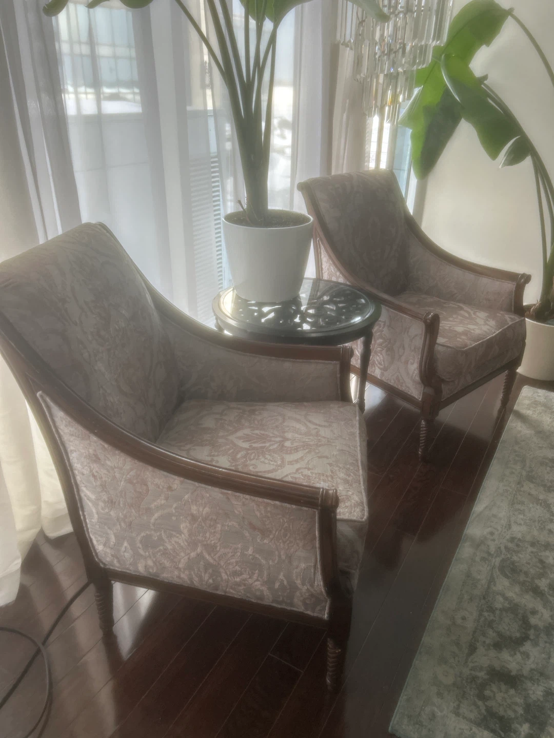 Pair of accent chairs with damask pattern