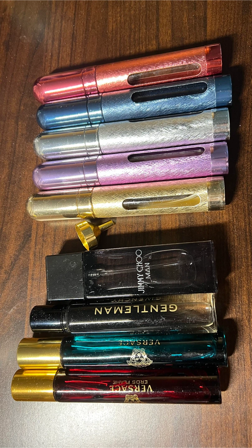 Collection of Travel Perfume Atomizers and Luxury Fragrances