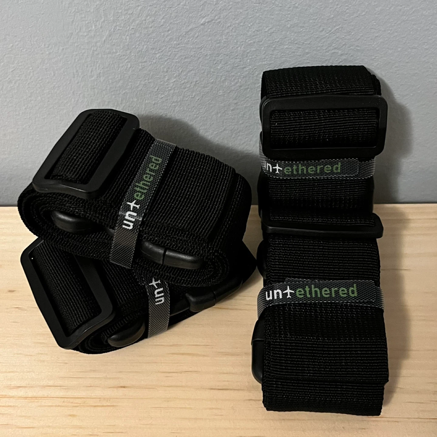 4 black luggage straps