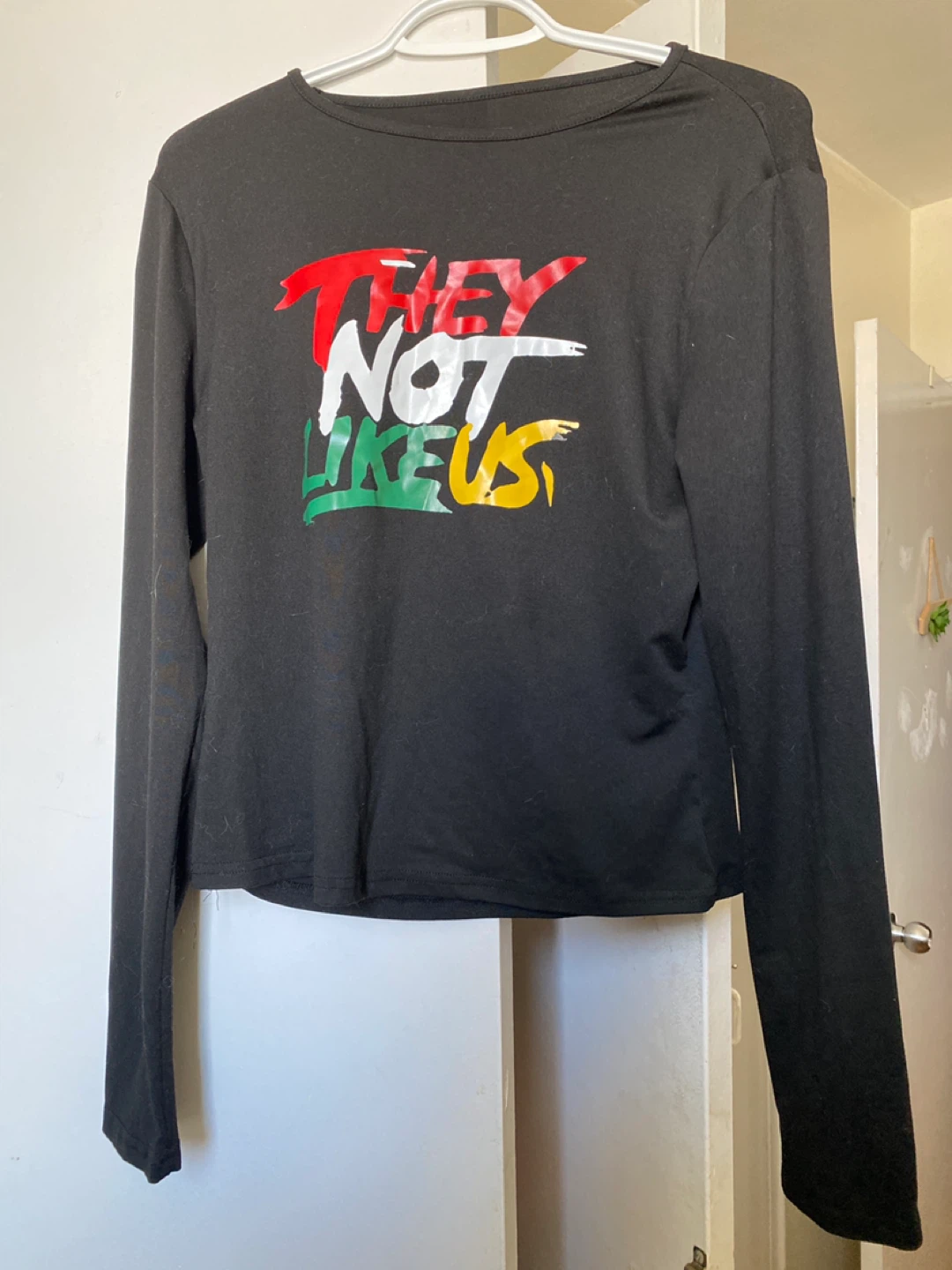 Black Long Sleeve T-Shirt with "THEY NOT LIKE US" Graphic