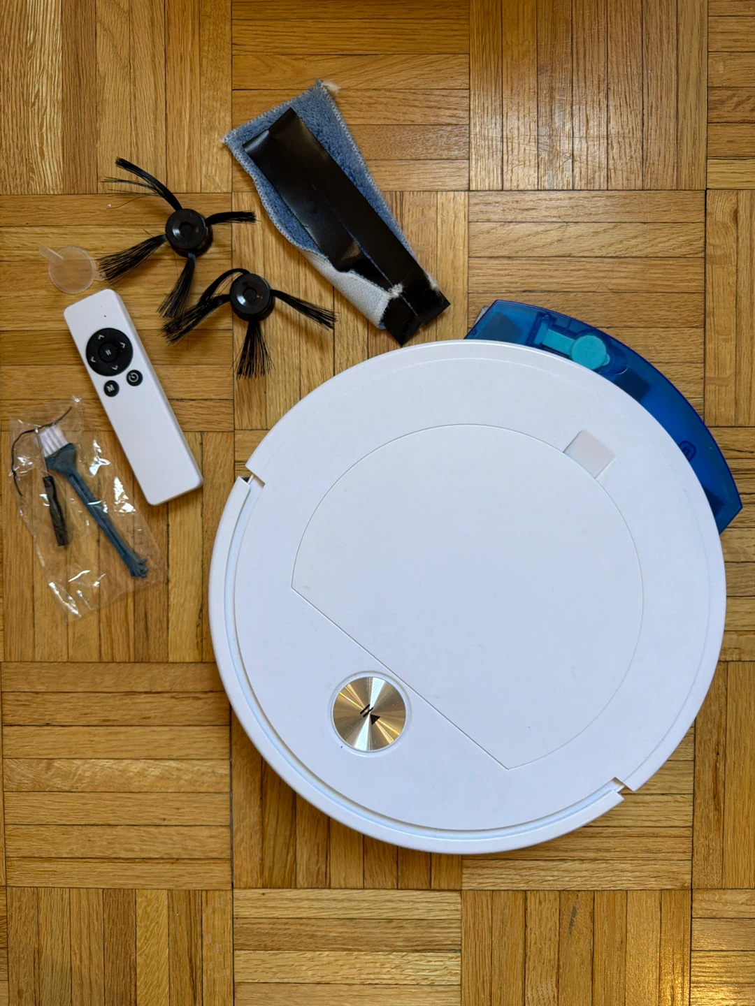 White Robot Vacuum Cleaner with Remote