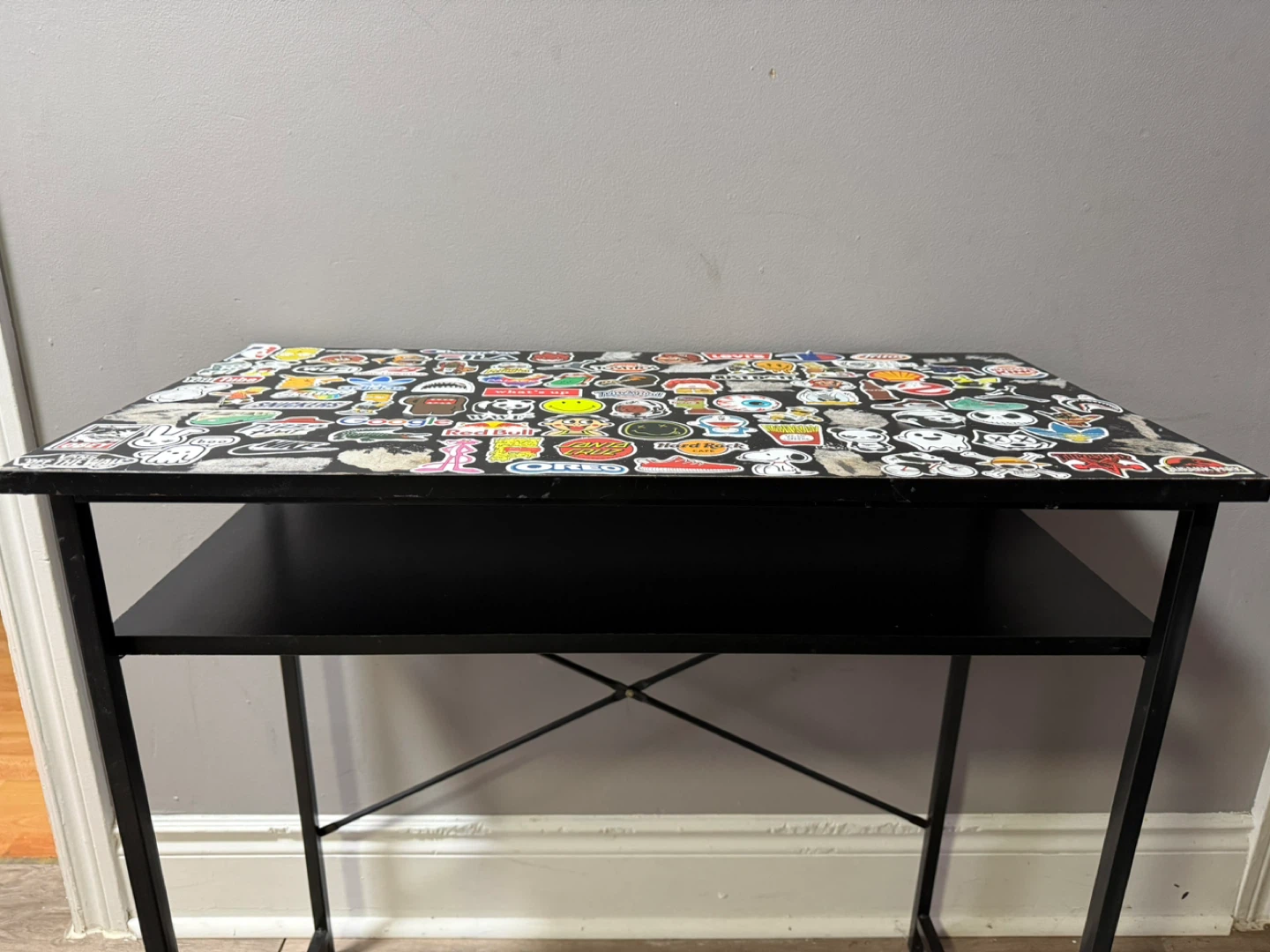 Sticker-Covered Black Desk with Shelf - photo 3