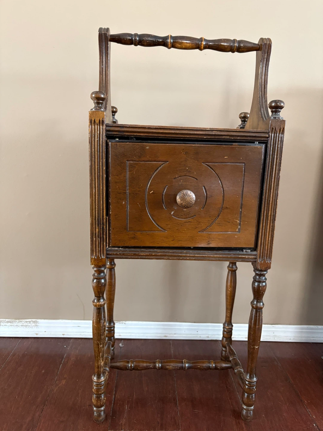 This is a vintage wooden smoker's cabinet or humidor stand