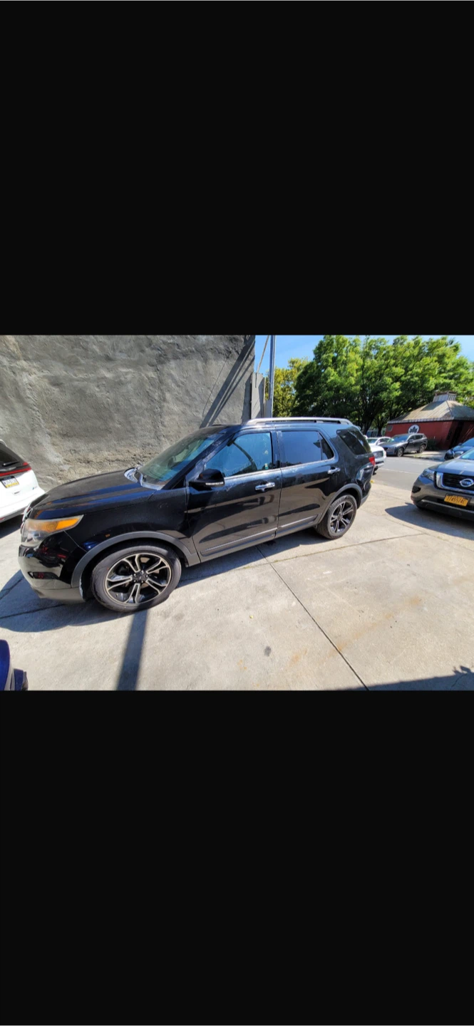 Black Ford Explorer SUV - photo 2
