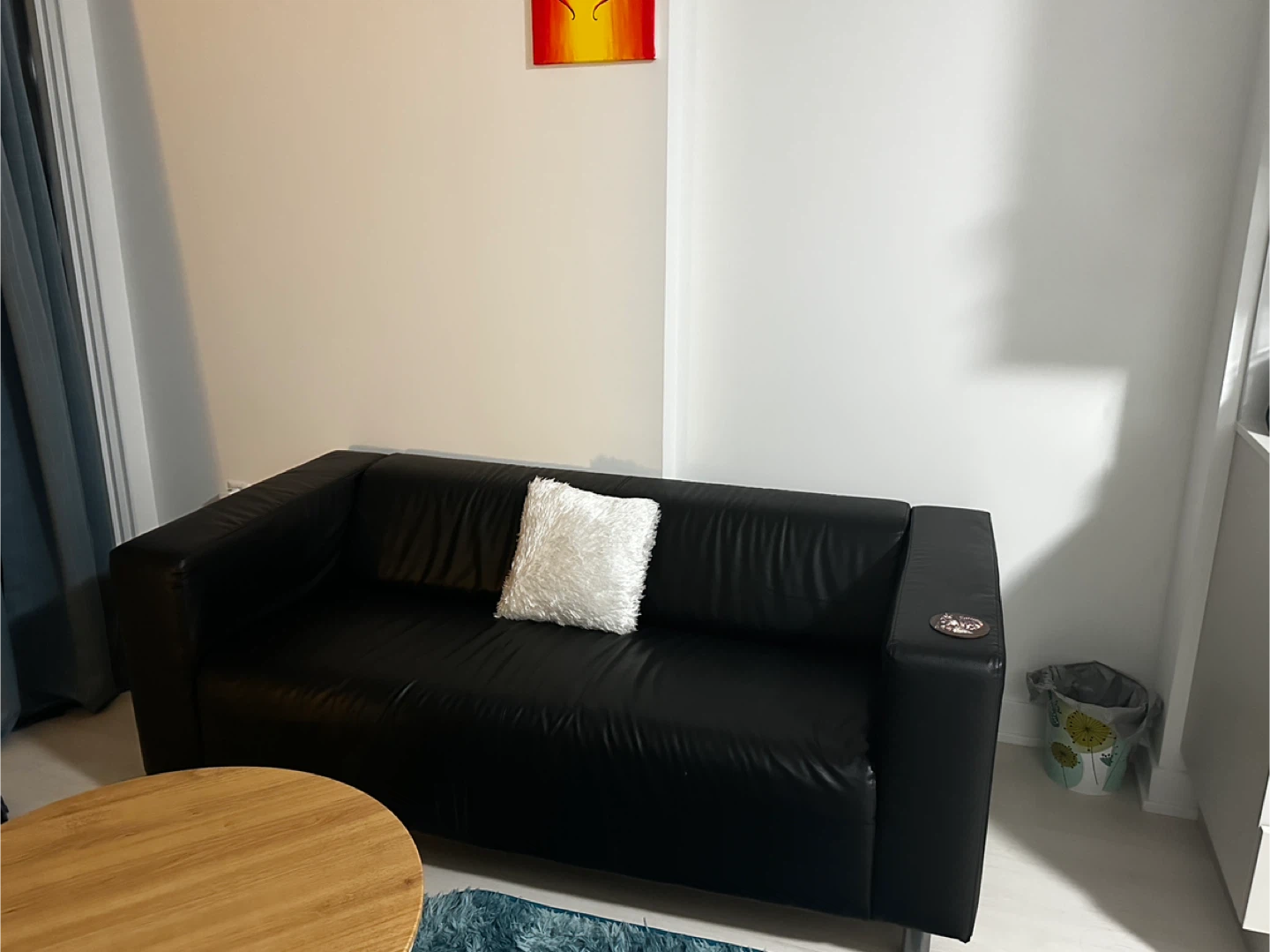 Black faux leather sofa