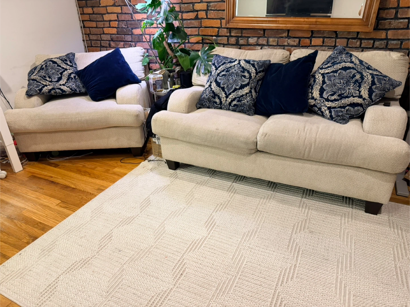 Cream Loveseat and Armchair with Blue Decorative Pillows