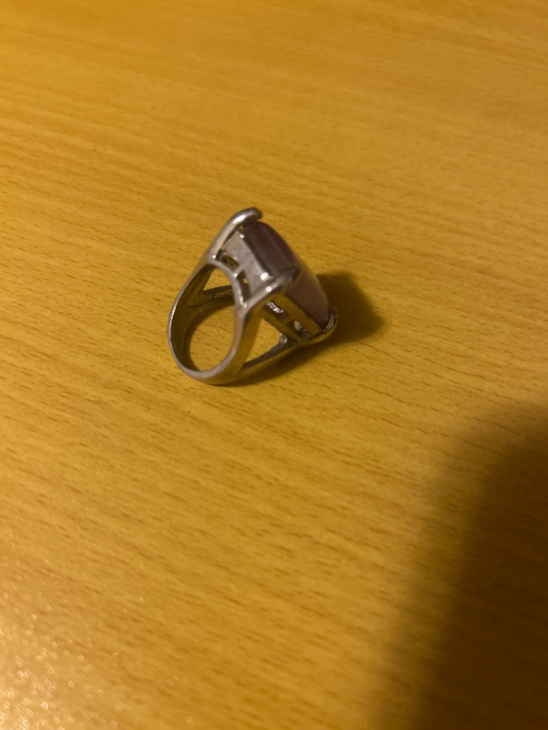 Silver-tone ring with purple stone