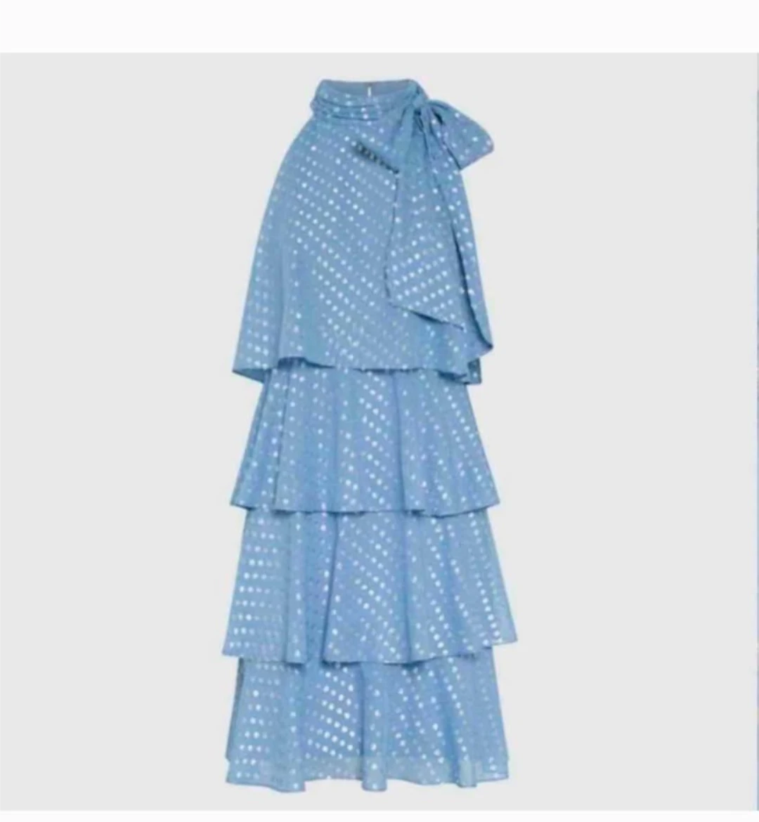 Blue tiered dress with silver polka dots and bow detail
