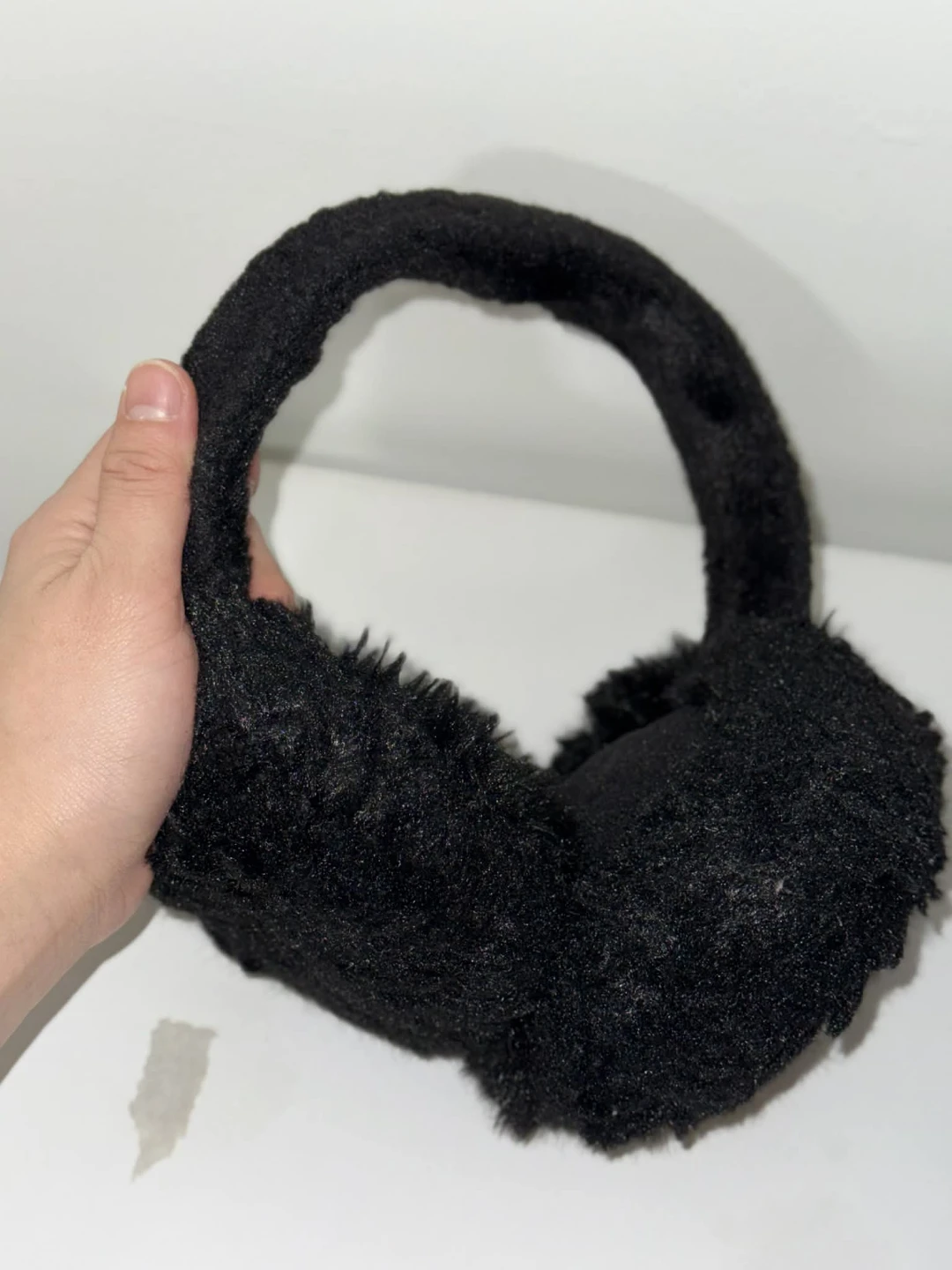 Black earmuffs and knit hats