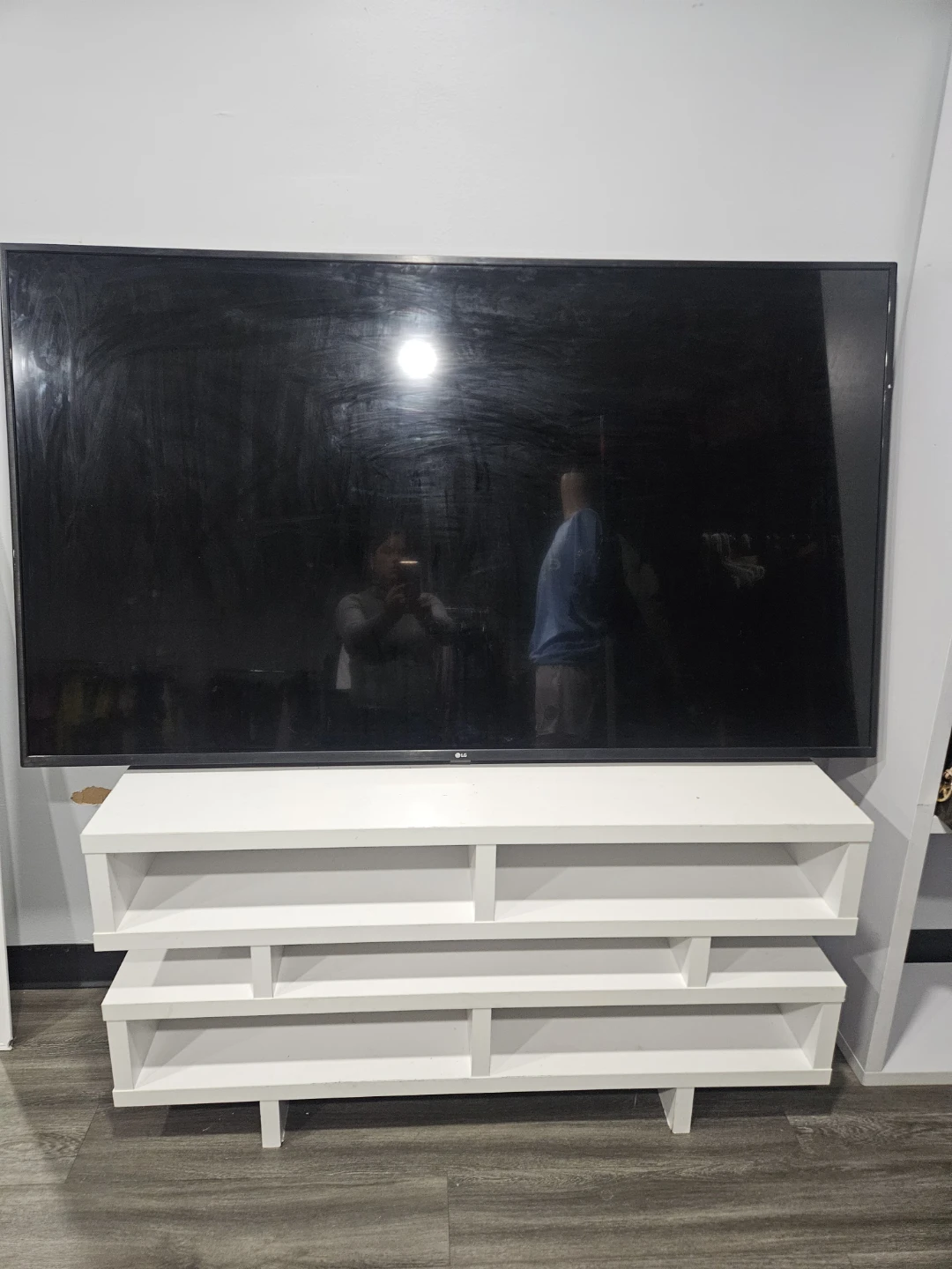 LG TV with White TV Stand