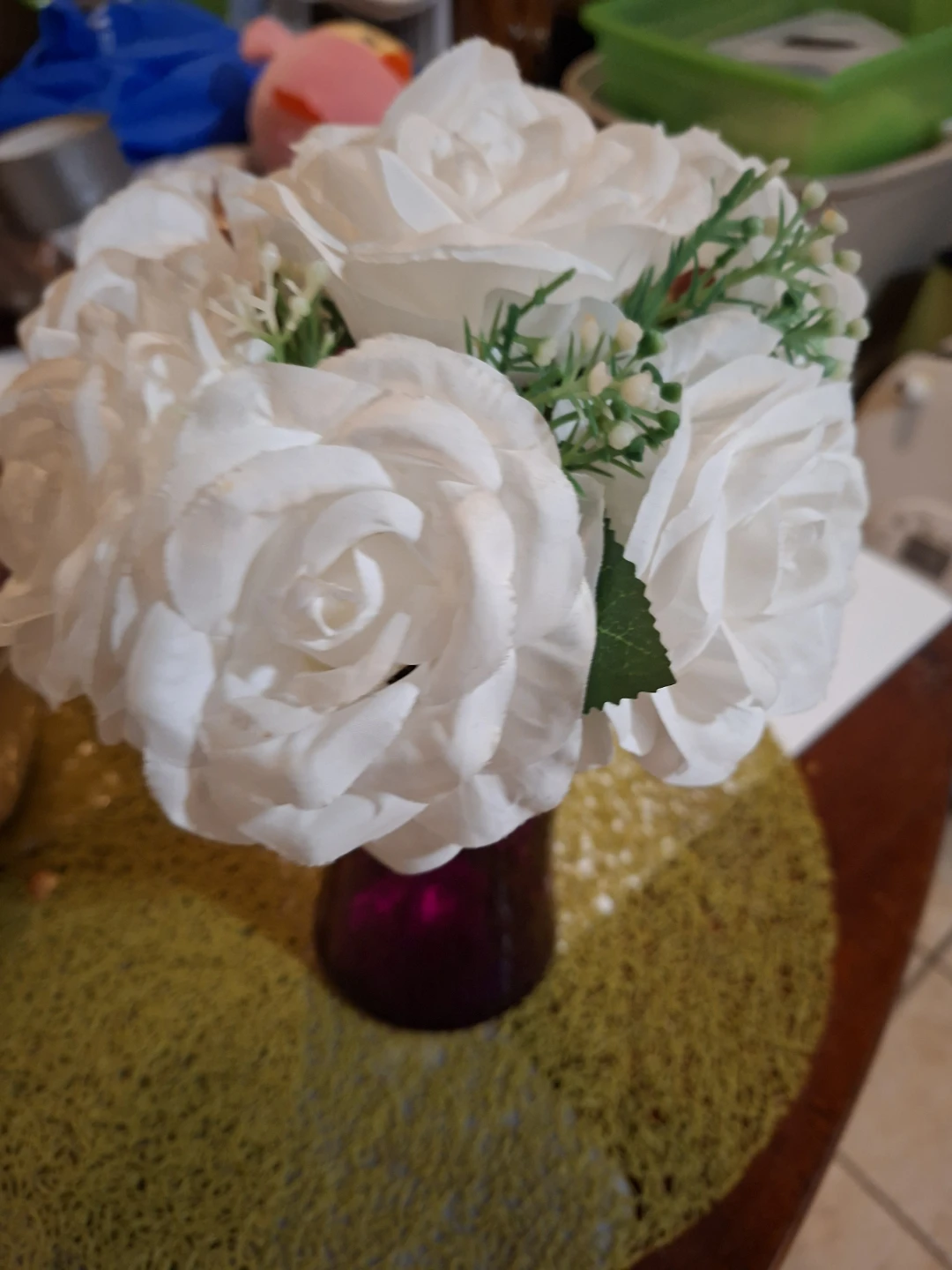 White Artificial Roses in Purple Vase