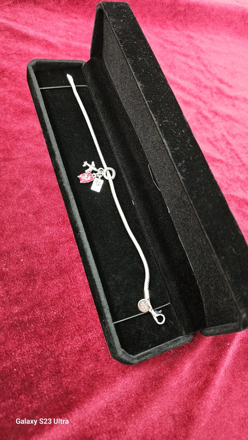 925 sterling silver bracelet with three charms
