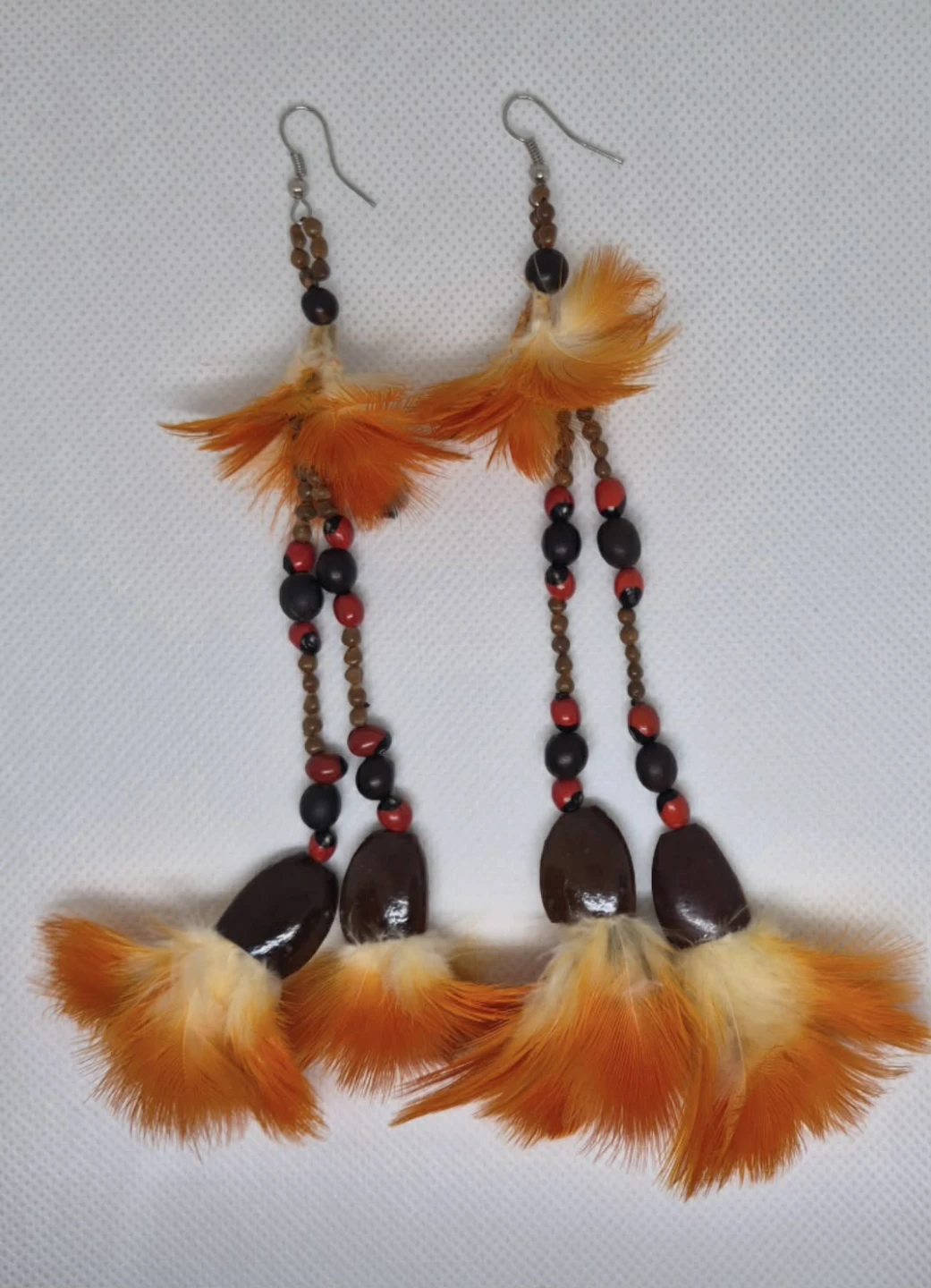 Handmade earrings with feathers