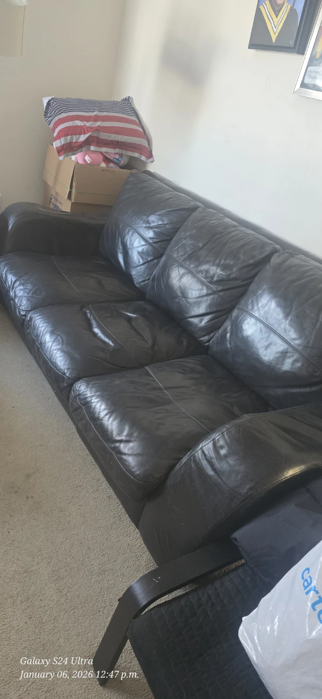 Black Leather Sofa - heavily Used
