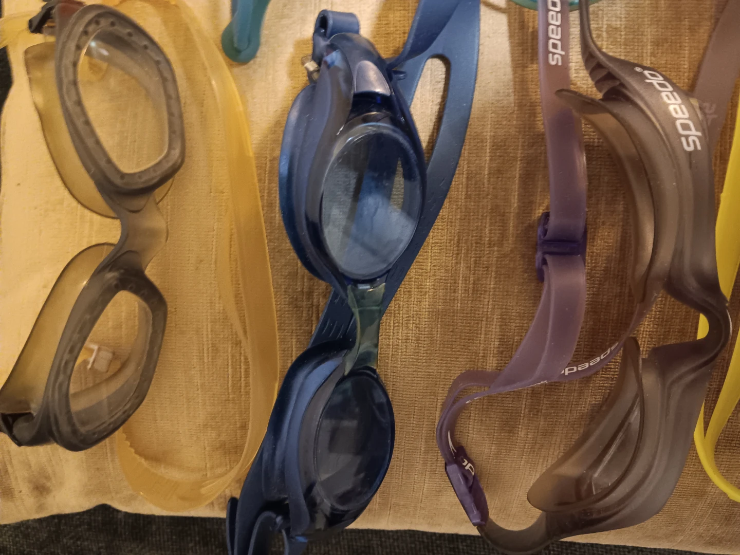 A collection of used swim goggles - photo 4