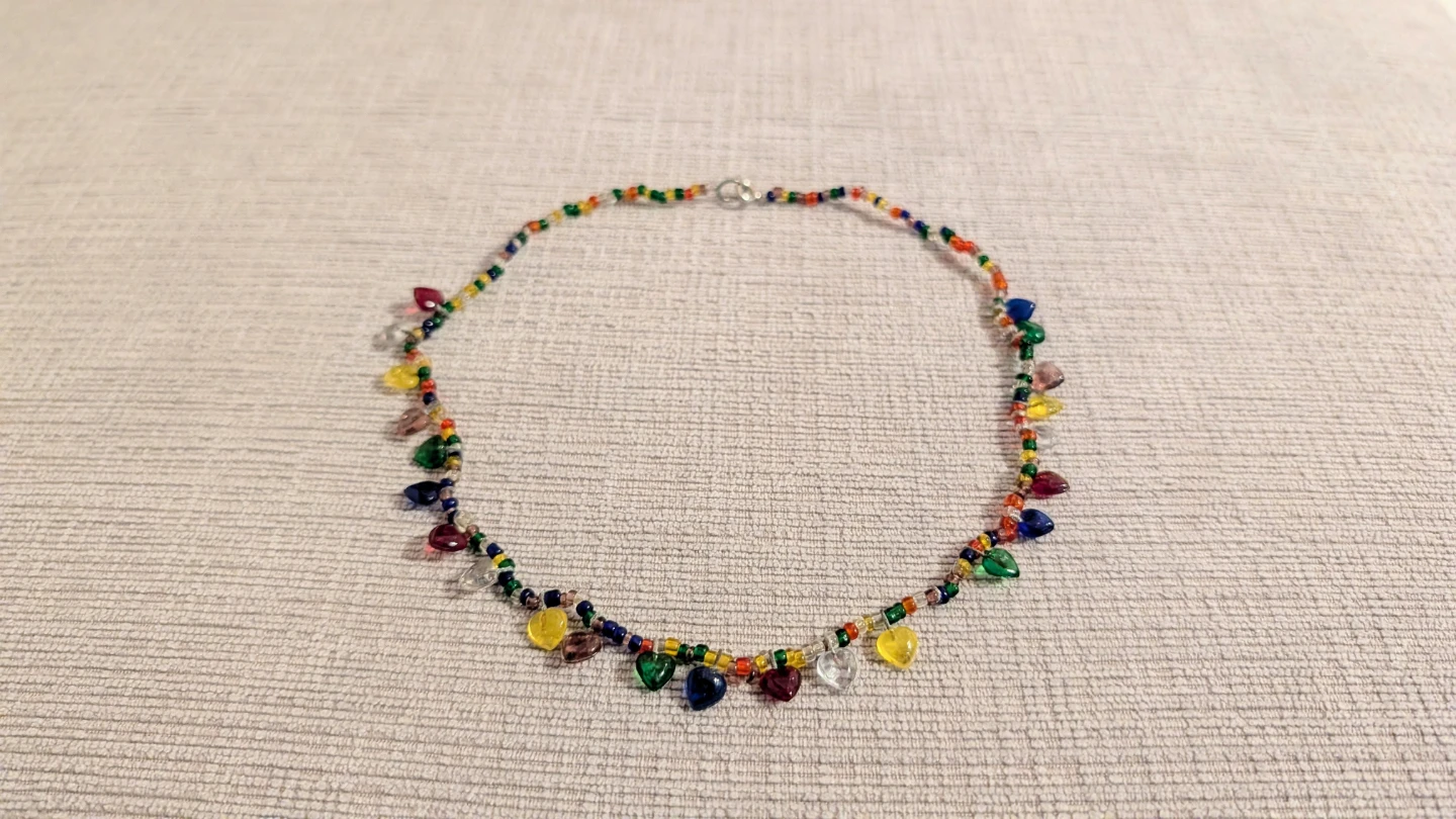 Brand New Beaded Necklace with Heart Charms