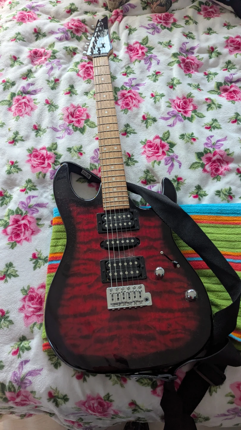 Ibanez GRX70QA Gio Series transparent red burst + new strings