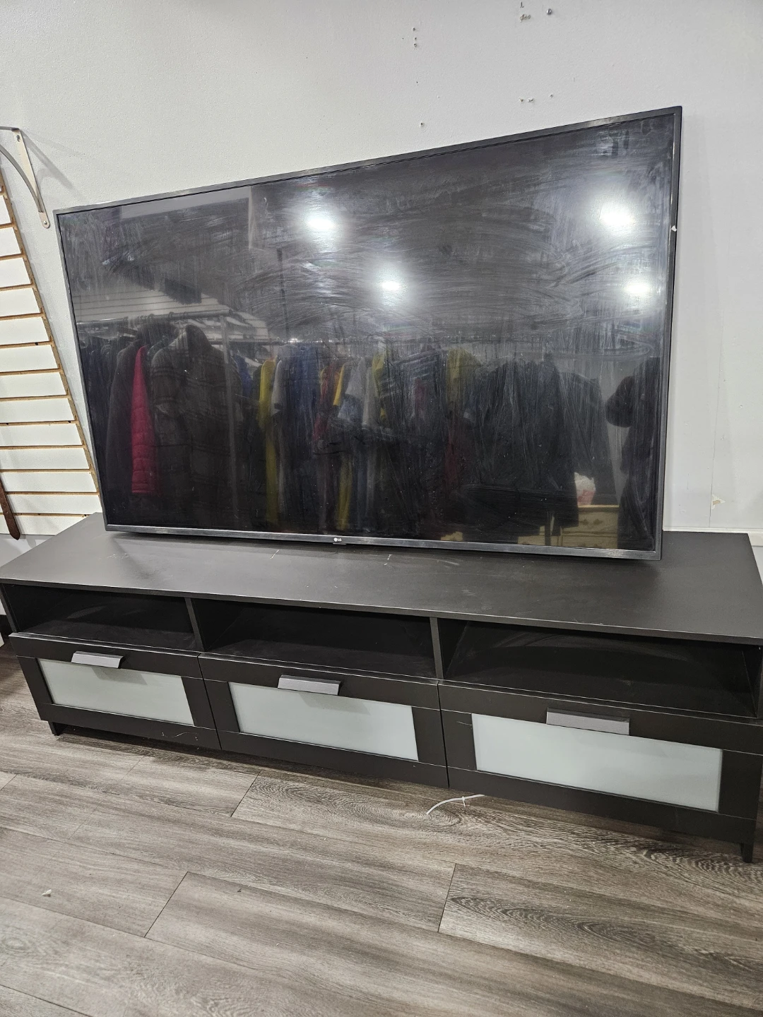 LG TV on Dark Brown TV Stand