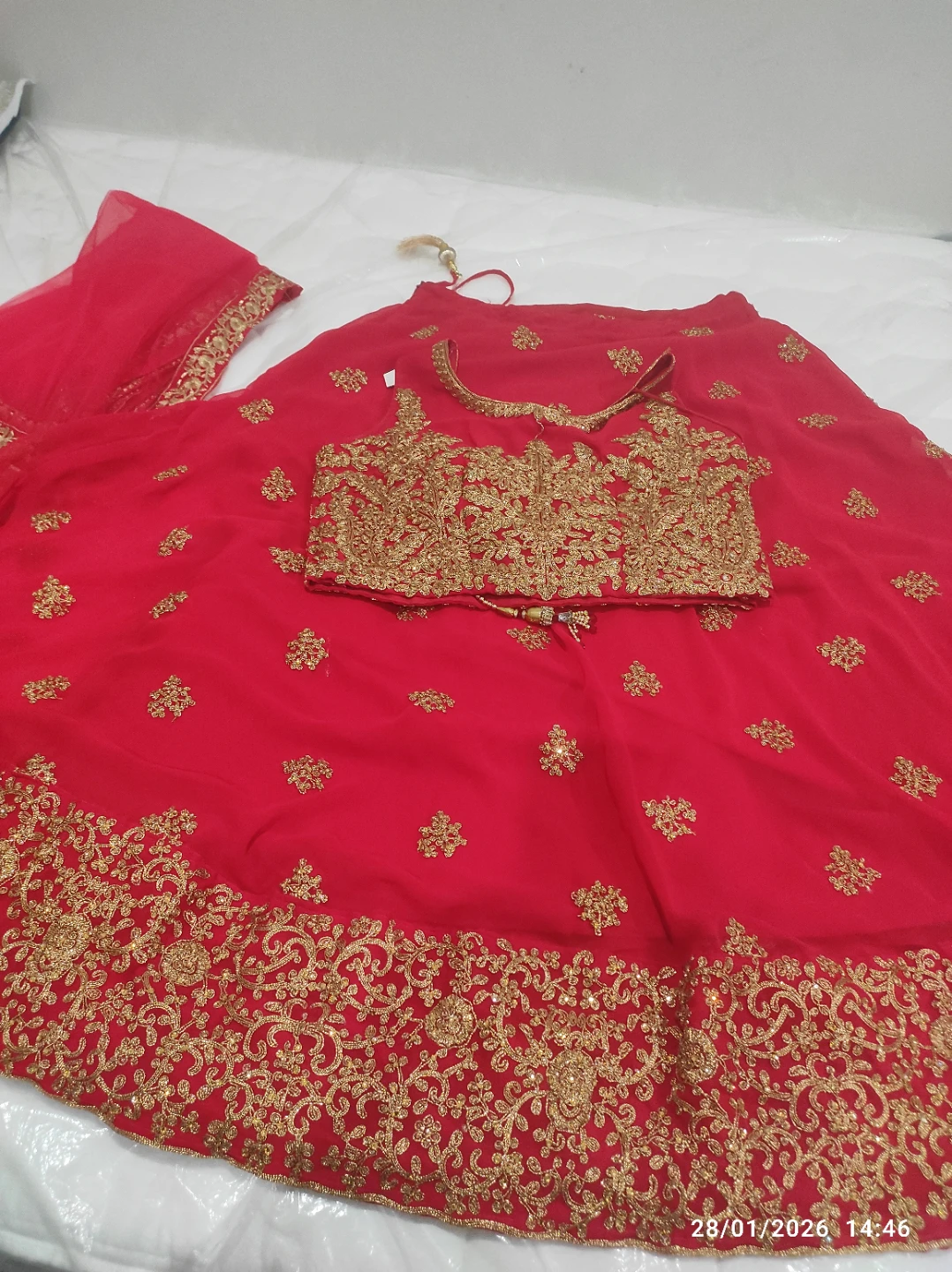 Red embroidered lehenga with gold accents
