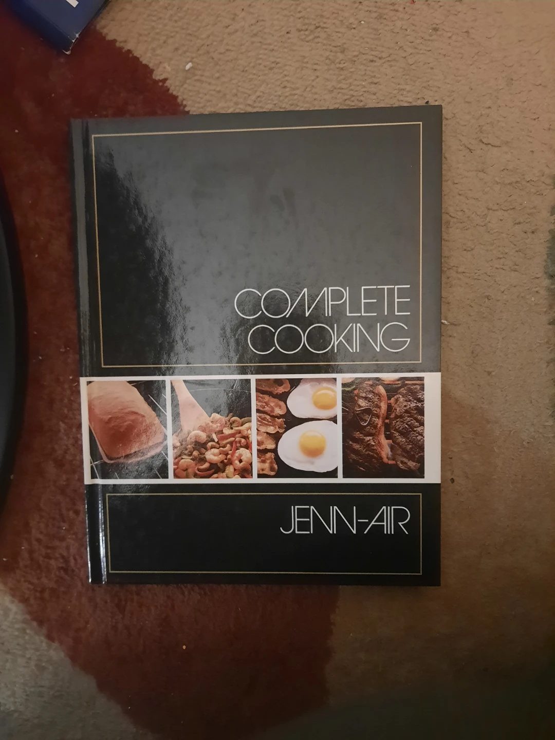 hardcover cookbook titled Complete Cooking pick up in st.albert