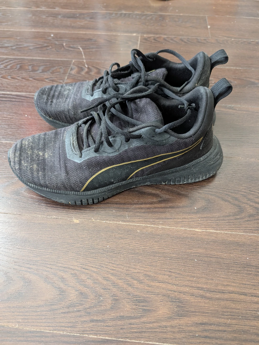 Puma running shoes - black and gold
