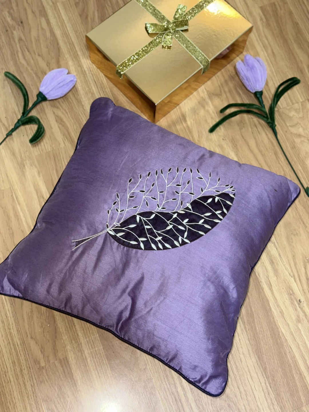Purple Throw Pillow with Feather Design