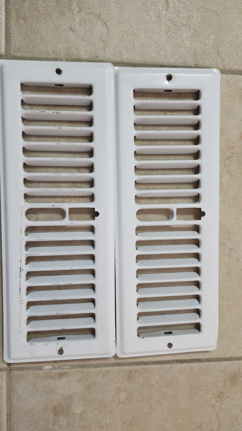 Two White Wall Vents