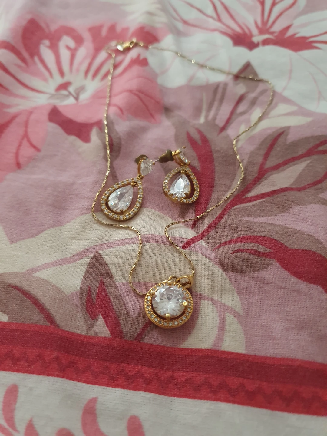 Gold-tone necklace and earring set with clear crystals