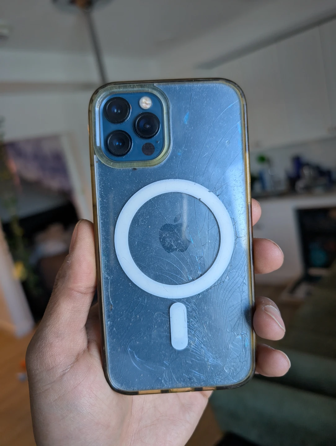 Blue iPhone 12 Pro with cracked back glass