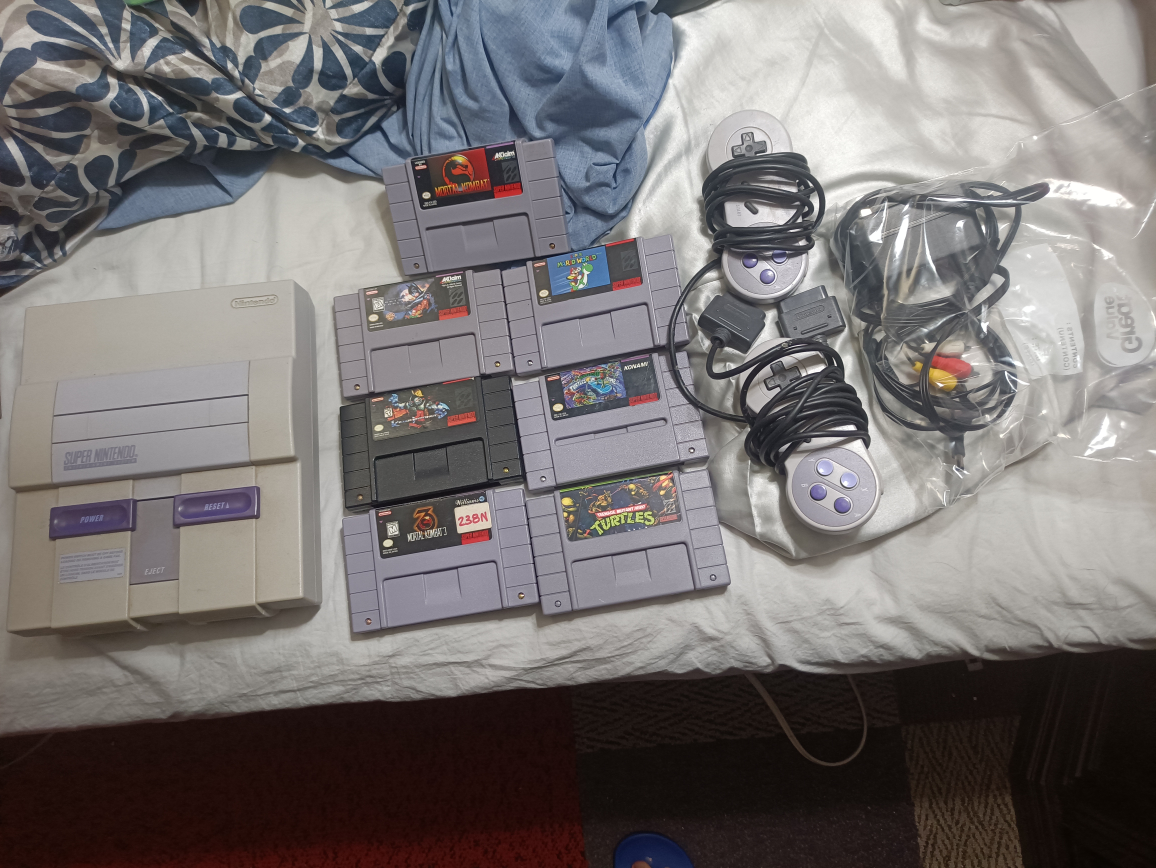 nintendo snes console bundle with 7 games and 2 controllers