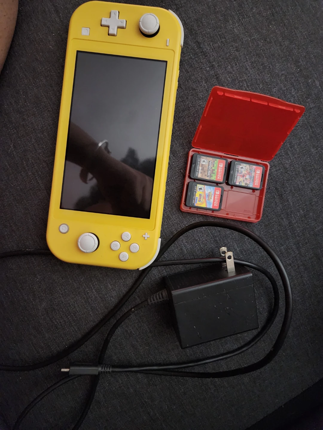 Yellow Nintendo Switch Lite with Games