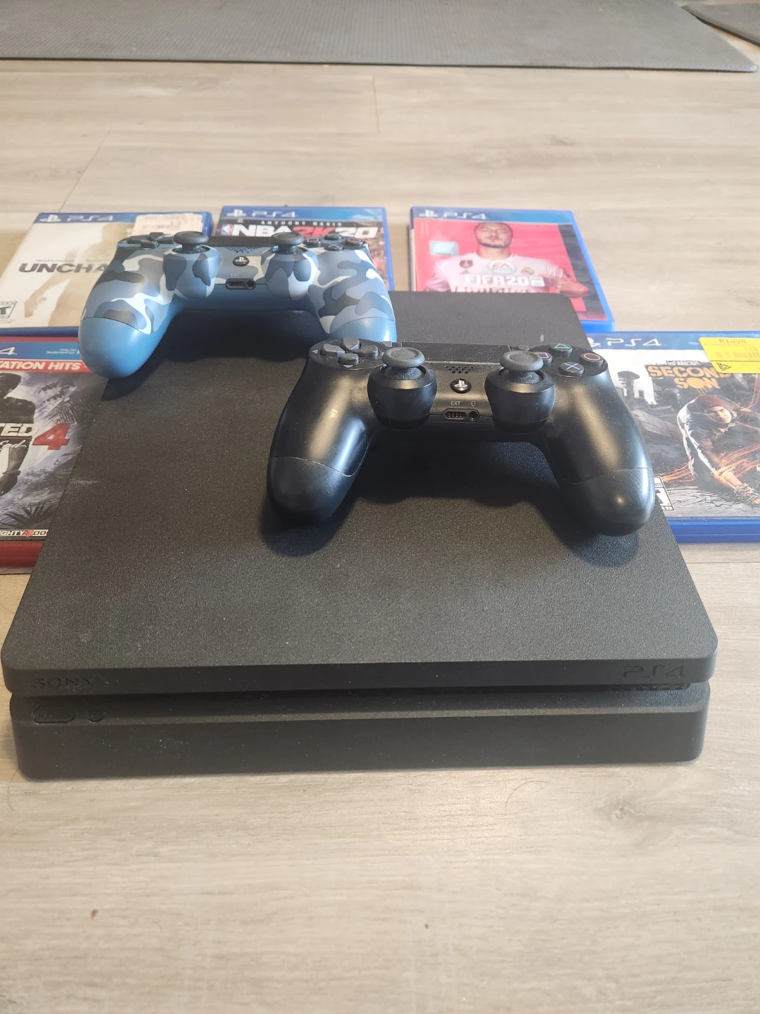 PlayStation 4 (PS4) 1 TB Console with Games & Controllers - photo 2