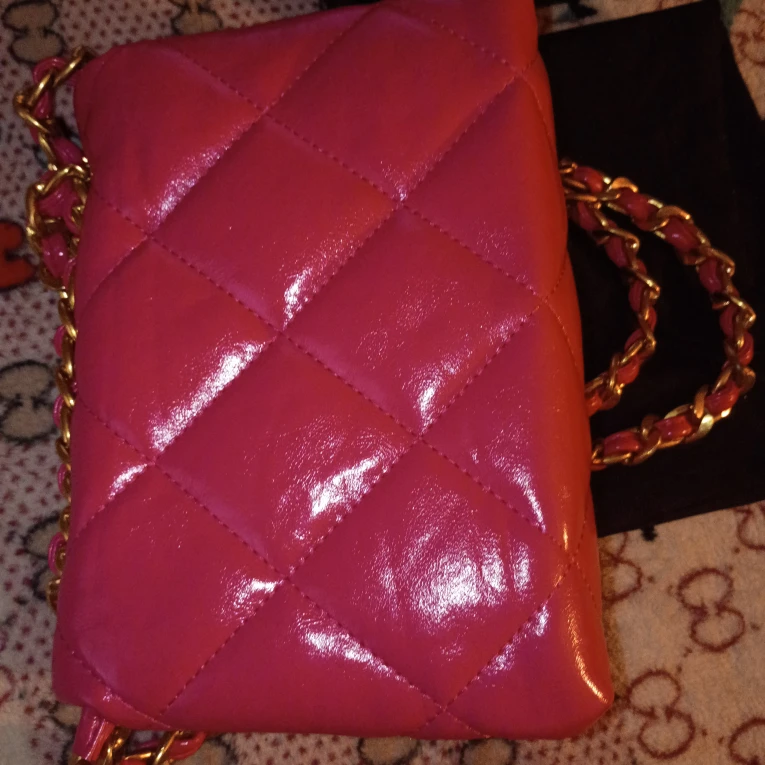 Chanel 22k pink gold hand bag