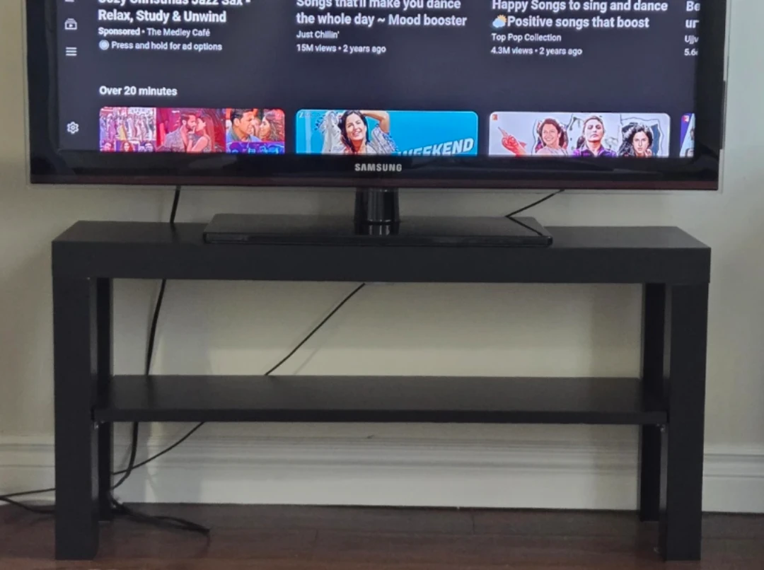 Samsung TV on Black TV Stand - photo 3