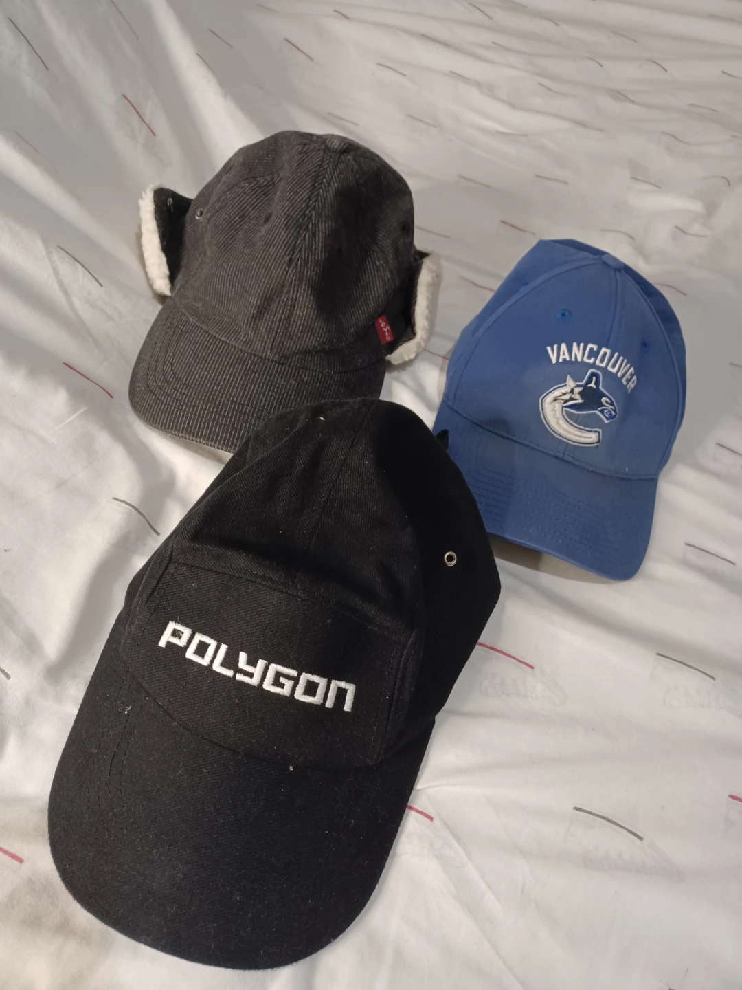 3 Hats: Vancouver Canucks, Polygon, and Levi's Ear Flap Hat
