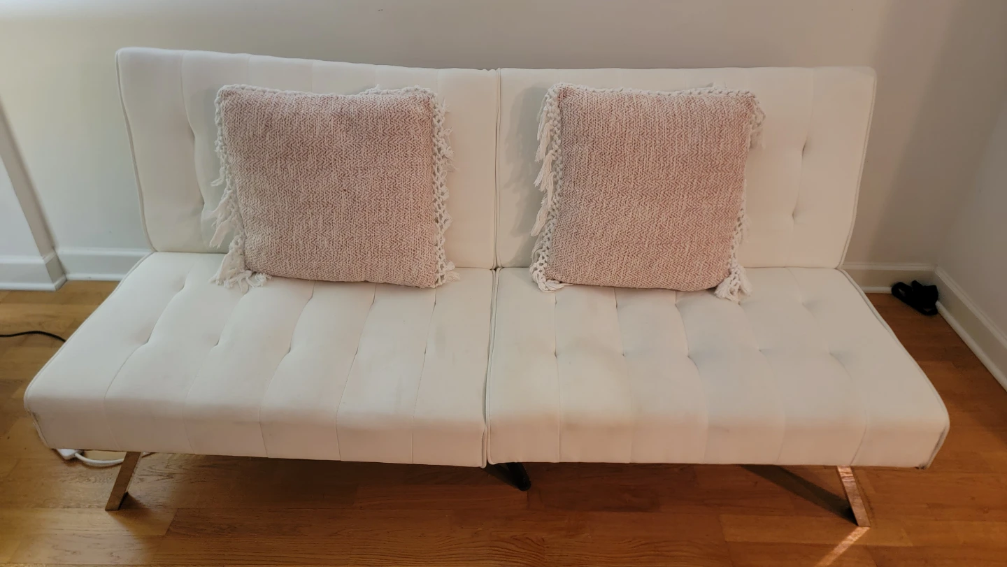 Convertible White Futon Sofa with Pink Pillows - photo 2