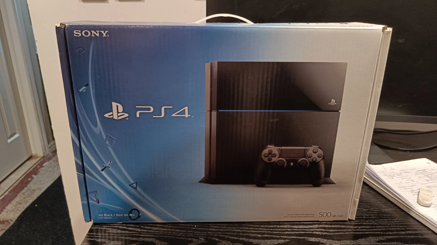 Used Sony PlayStation 4 w/ 2 Controllers