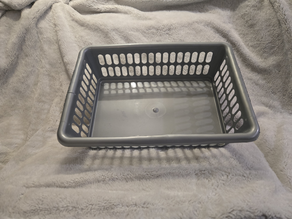 Grey plastic storage basket