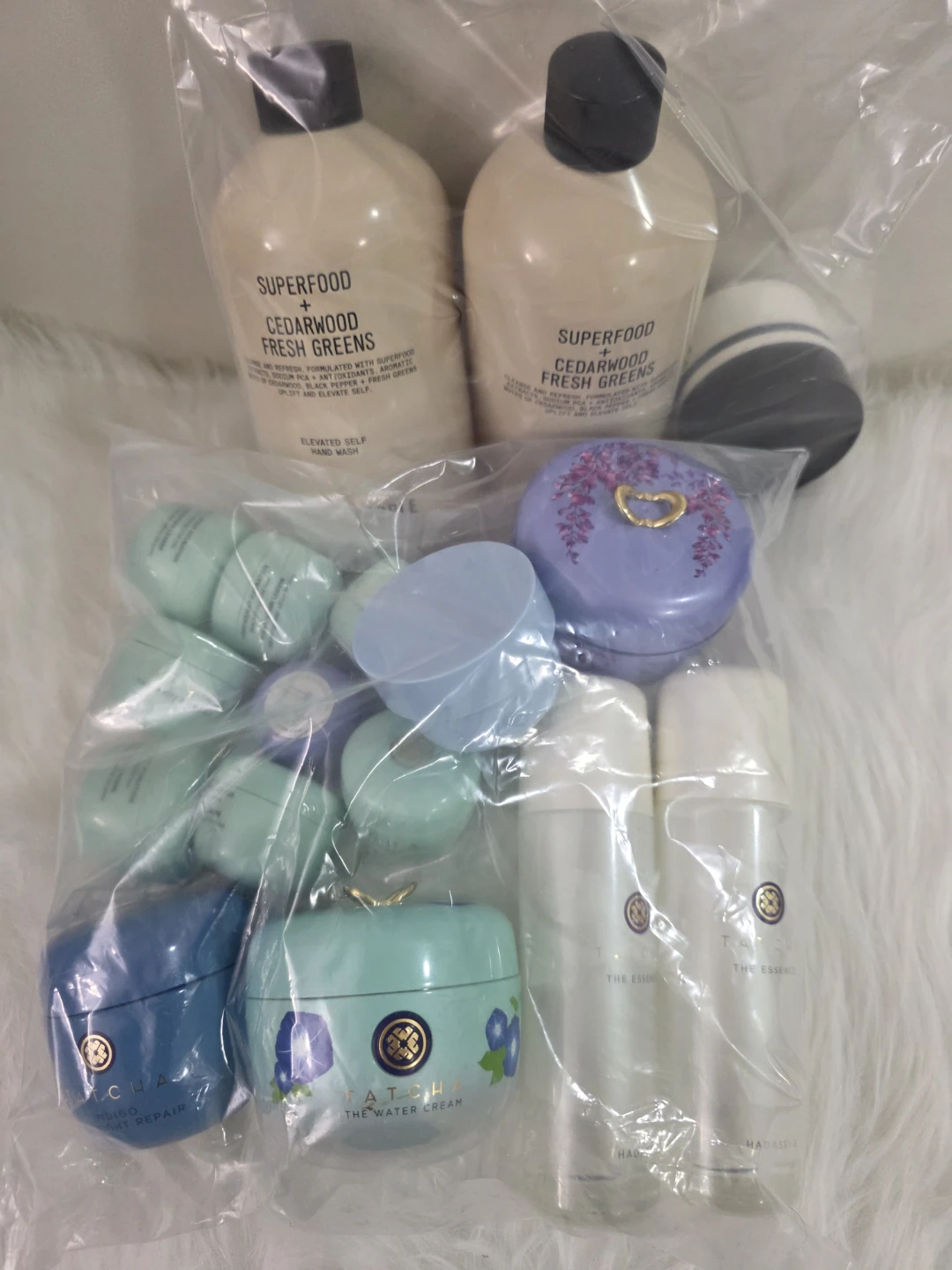 Empty Tatcha & Superfood Cedarwood Fresh Greens bottles