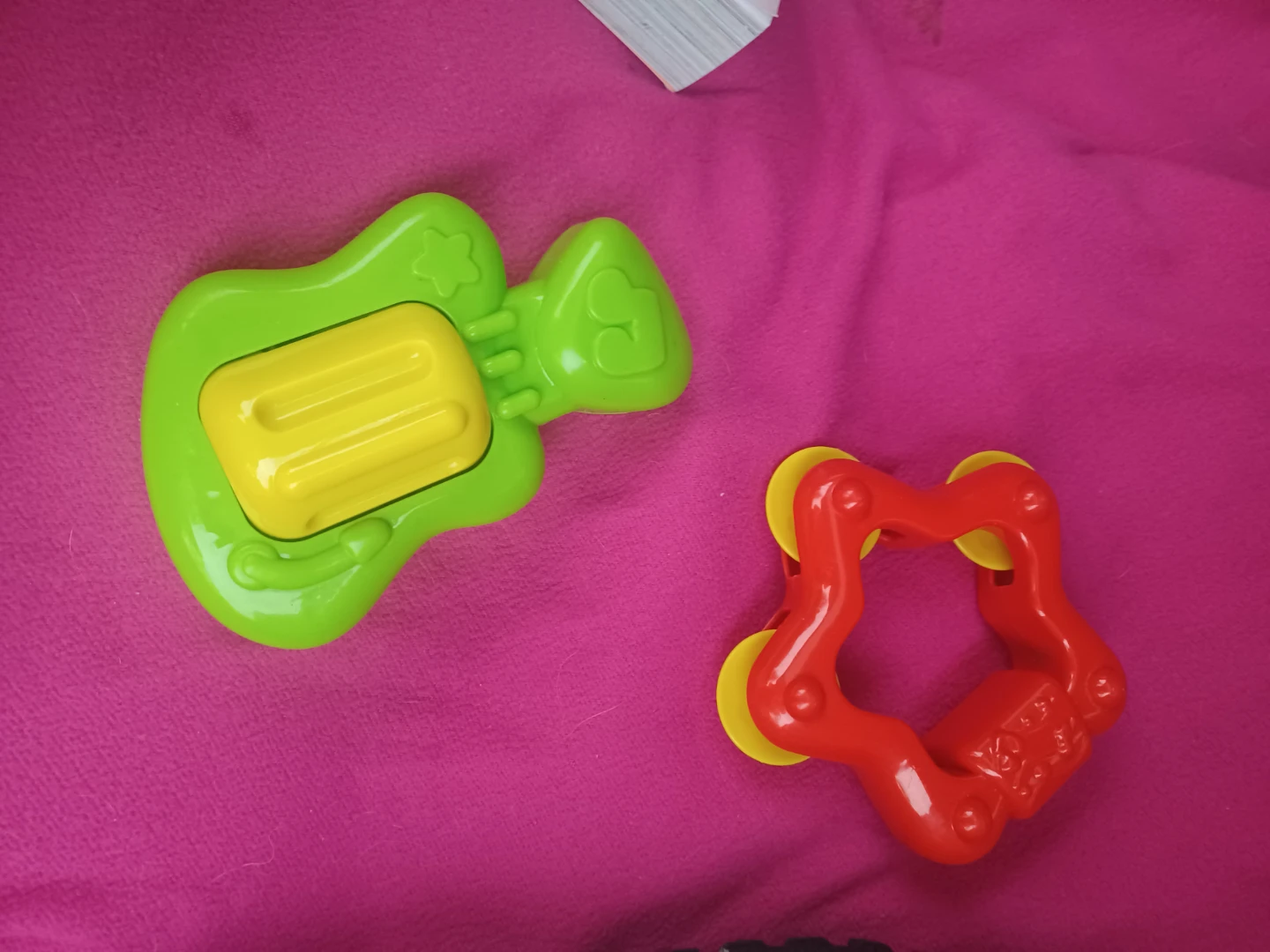 Green Guitar Toy and Red Star Tambourine
